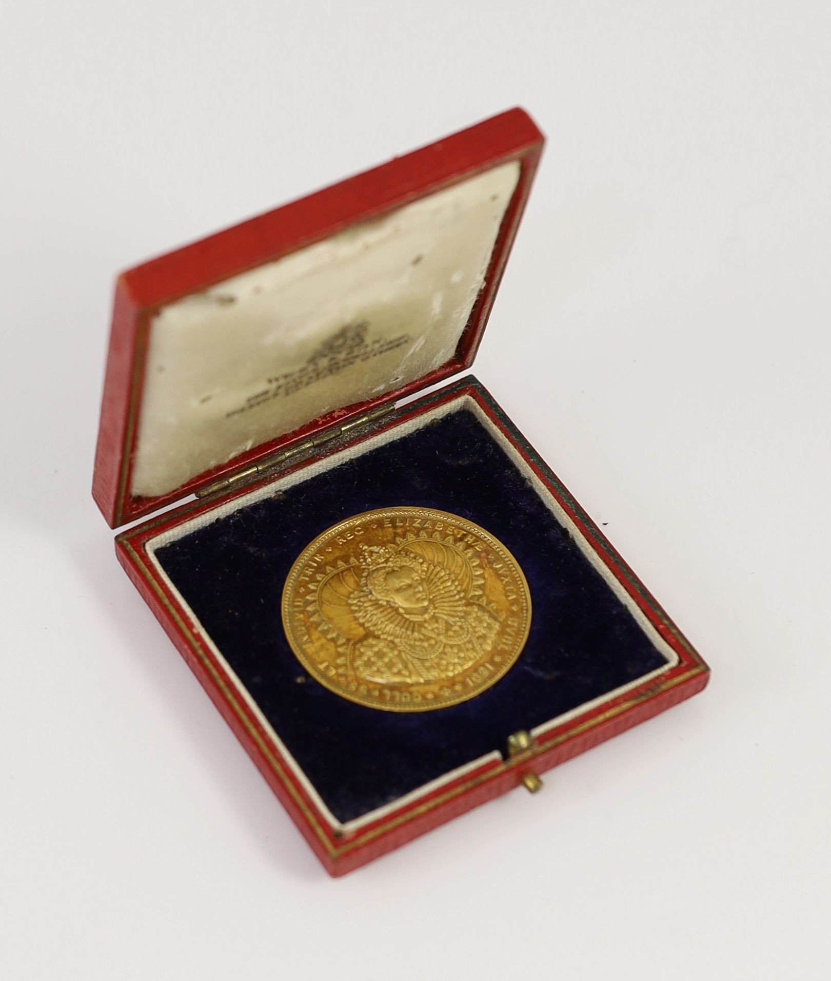 A cased George V Trinity College, Dublin, 15ct gold medal 'Jurisprudence, Science & Politics', awarded to Michael J.P.P.L Hogan, 1929